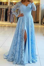 Woman wearing a light blue evening gown with a slit in a clothing store.