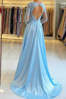Light blue evening gown with a high slit in a store setting